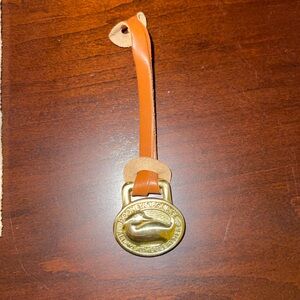 Dooney & Bourke Tan Leather Key Fob with Gold Medallion